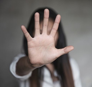 woman holding out her hand in front of her